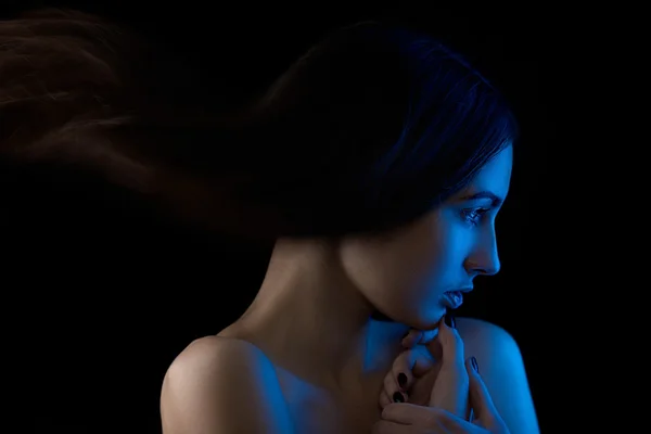 Colored light on brunette girl — Stock Photo, Image