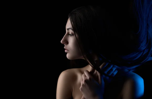 Colored light on brunette girl — Stock Photo, Image