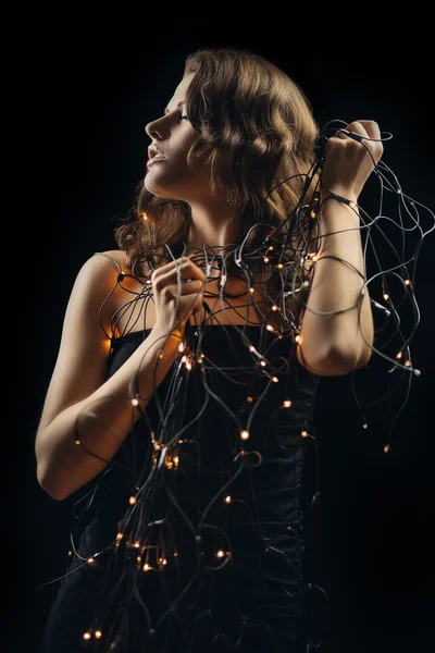 Menina com lâmpadas decorativas — Fotografia de Stock