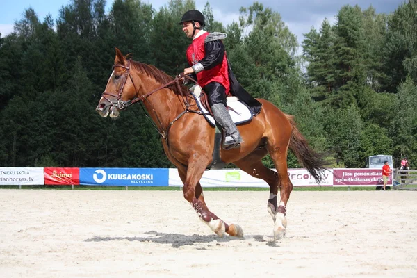 RIGA, LATVIA - AUGUST 12: Latvian sportsman Guntars Silinsh ridi — Stock Photo, Image