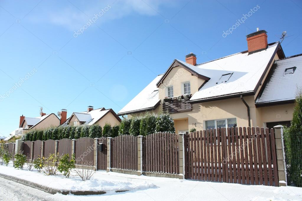 View on street with cottages in winter