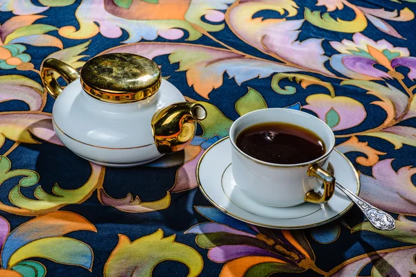 Tea set on a tablecloth — Stock Photo, Image