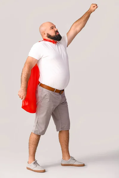 Overweight Man Cape Grey Background Weight Loss Concept — Stock Photo, Image