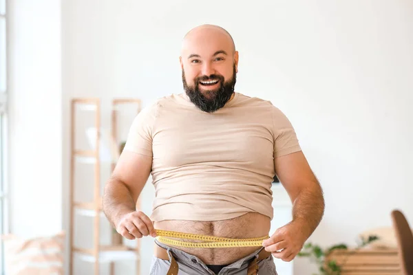 Happy Overweight Man Measuring His Waist Home Weight Loss Concept — Stock Photo, Image