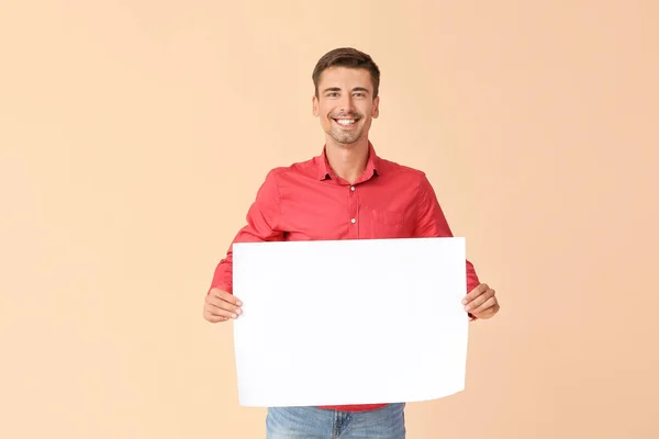 Young Man Blank Paper Sheet Color Background — Stock Photo, Image