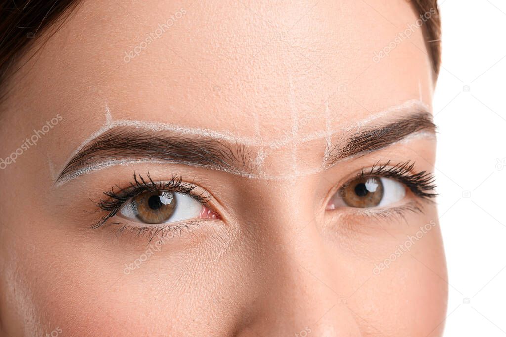 Young woman undergoing eyebrow correction procedure, closeup