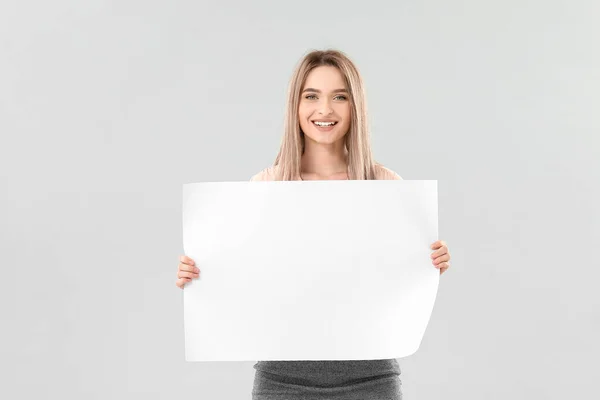 Young Woman Blank Paper Sheet Light Background — Stock Photo, Image