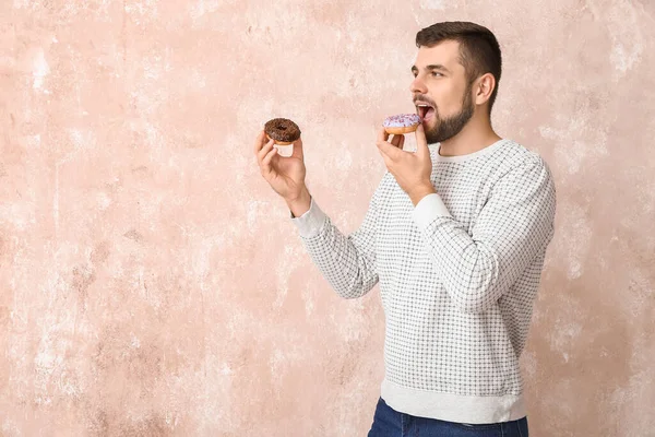 Handsome Young Man Sweet Donuts Color Background — Stock Photo, Image