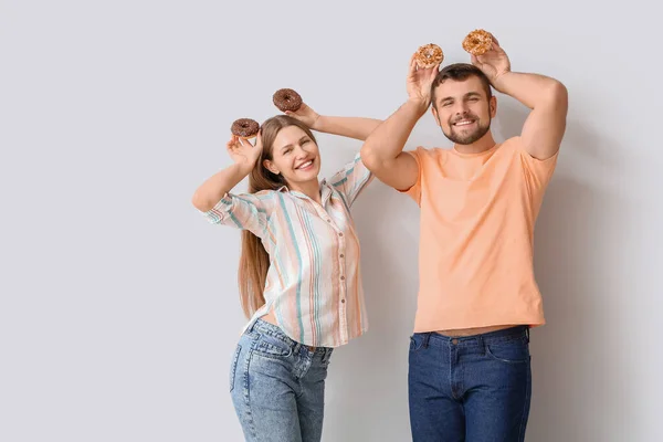 Young Couple Sweet Donuts White Background — Stock Photo, Image