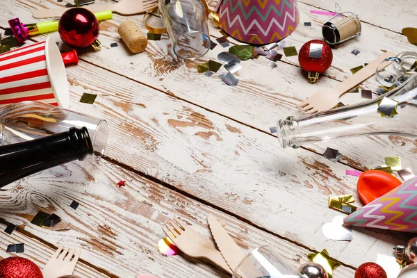 Mess after party celebration on wooden background