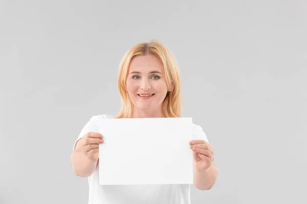 Woman Blank Paper Sheet Grey Background — Stock Photo, Image