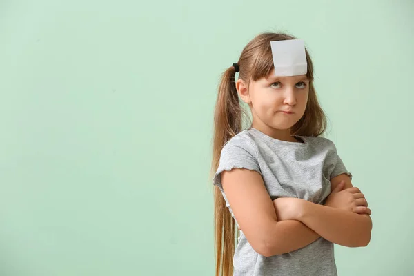 Displeased Little Girl Blank Note Paper Her Forehead Color Background — Stock Photo, Image