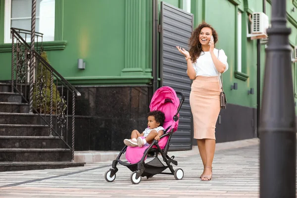 African American Woman Her Cute Baby Stroller Outdoors — Stock Photo, Image