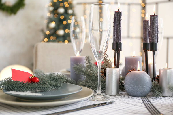 Beautiful table setting with Christmas decorations in living room