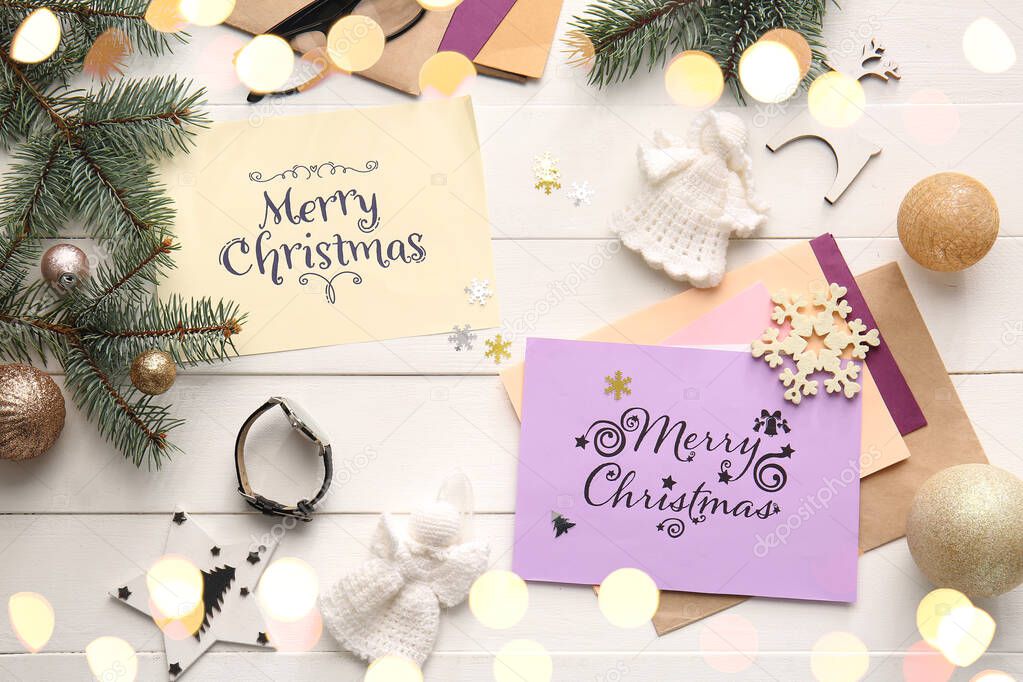 Composition with beautiful Christmas greeting cards on table