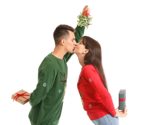 Young Couple Christmas Gifts Kissing Mistletoe Branch White Background — Stock Photo, Image