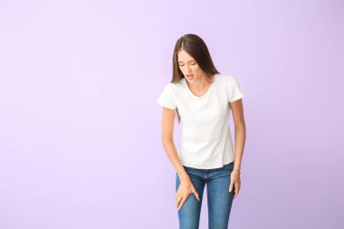 Woman with problem of limbs numbness on color background. Diabetes symptoms clipart