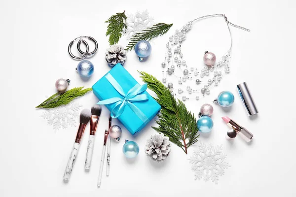 Christmas composition with cosmetics on white background