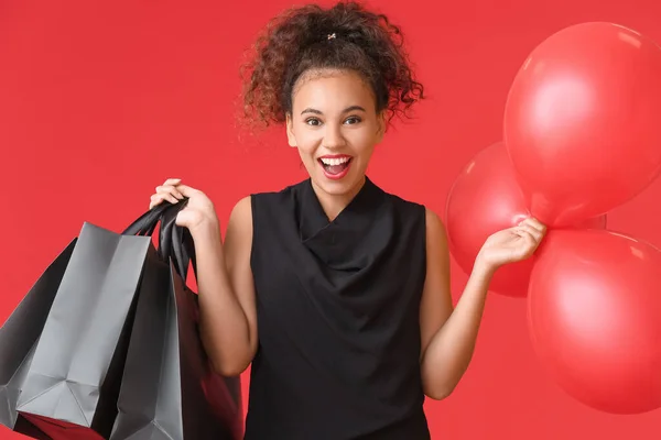Beautiful African American Woman Shopping Bags Balloons Color Background Black — Stock Photo, Image