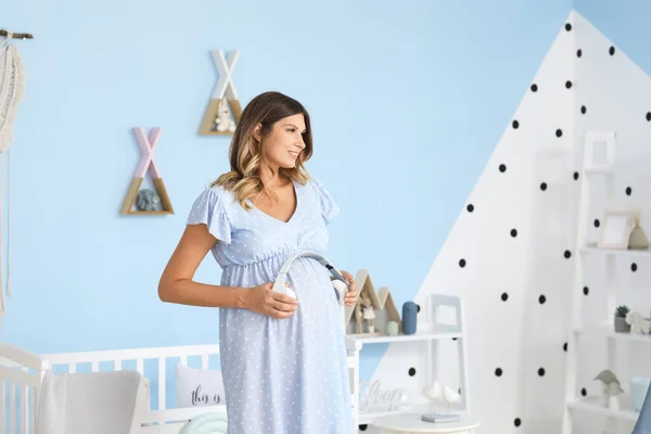 Beautiful Pregnant Woman Putting Headphones Her Belly Home — Stock Photo, Image