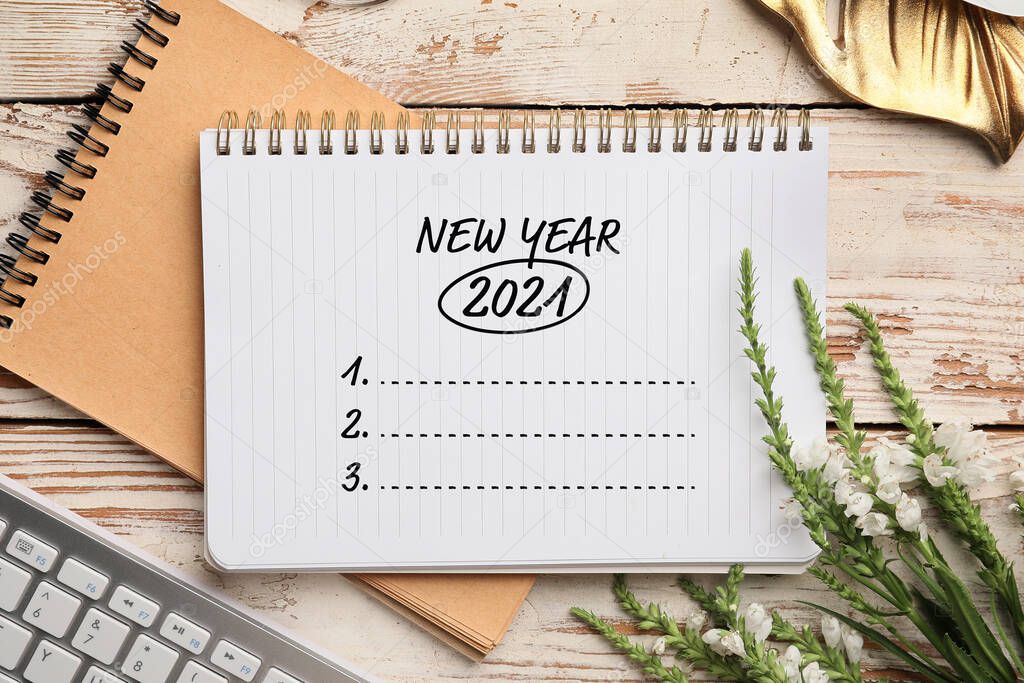 Notebook with empty to-do list for 2021 year on white wooden background