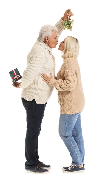 Mature Couple Kissing Mistletoe Branch White Background — Stock Photo, Image