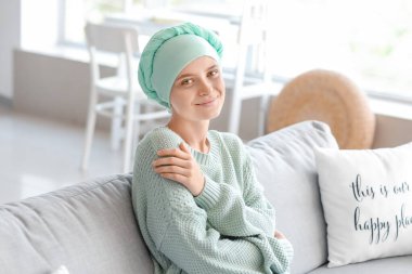 Woman after chemotherapy at home clipart