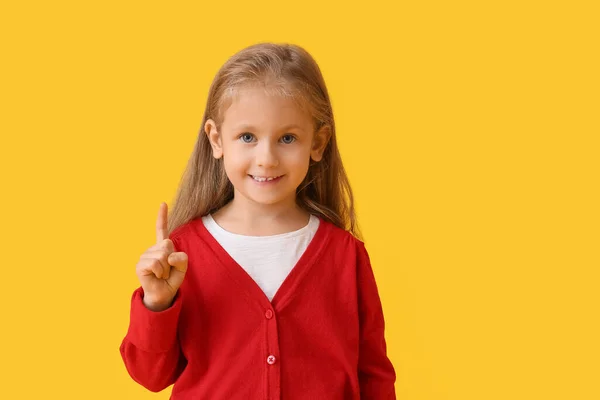 Cute Little Girl Raised Index Finger Color Background — Stock Photo, Image