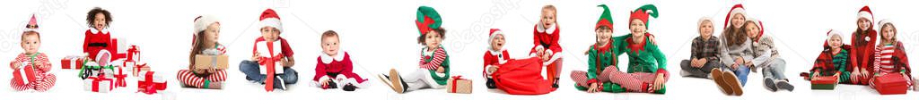 Happy little children with Christmas gifts on white background