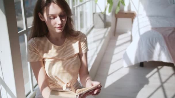 Beautiful Young Woman Reading Book Window Bedroom — Αρχείο Βίντεο