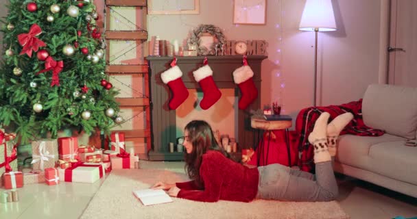 Woman Reading Book Fireplace Home Christmas Eve — Stock Video