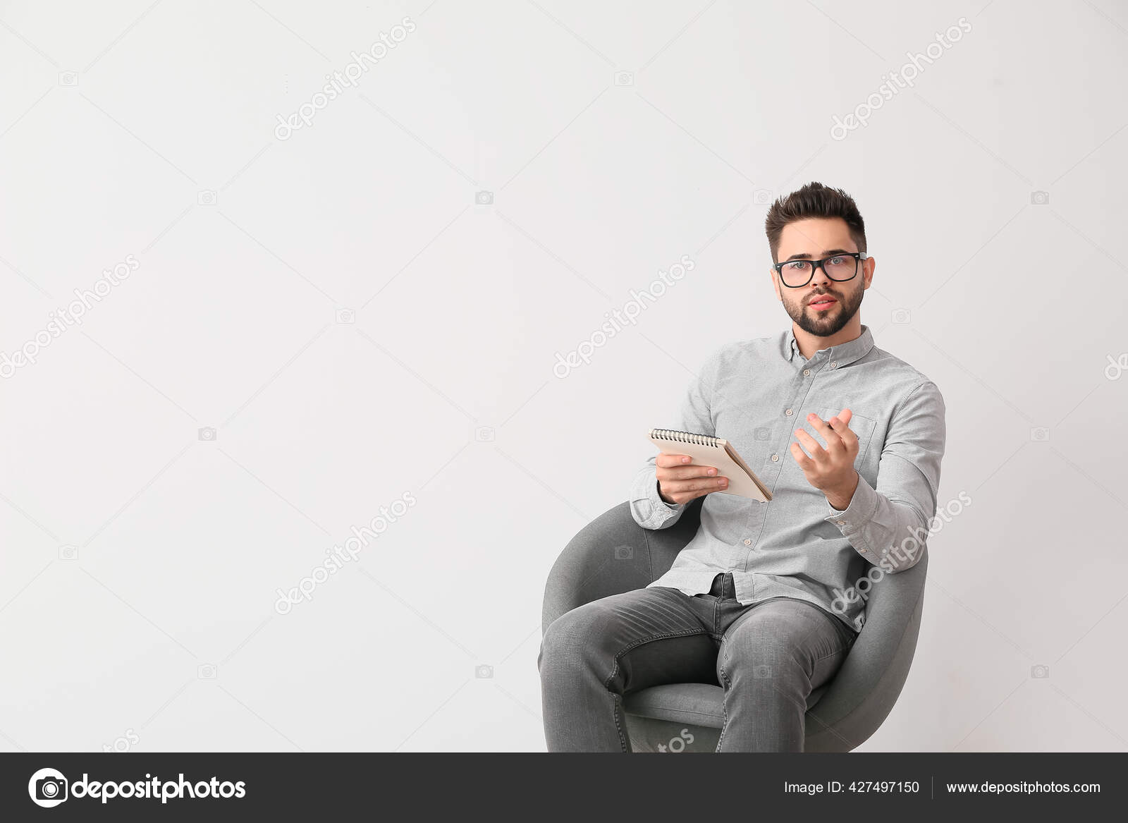 Male Psychologist Sitting Armchair Light Background Stock Photo by ©serezniy 427497150