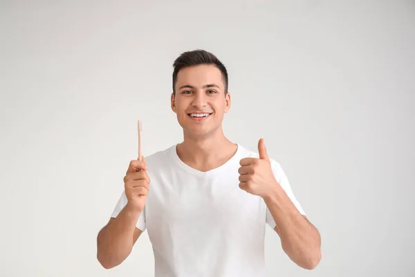 Young Man Tooth Brush Showing Thumb Light Background — Stock Photo, Image