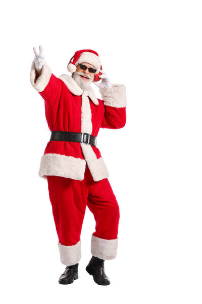 Cool Santa Claus listening to music on white background