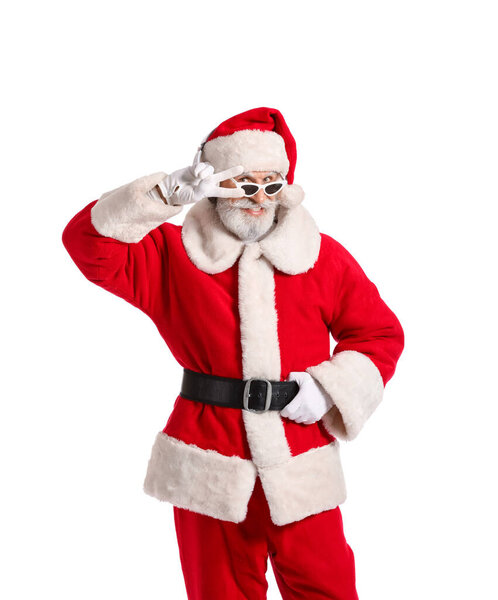 Cool Santa Claus listening to music on white background