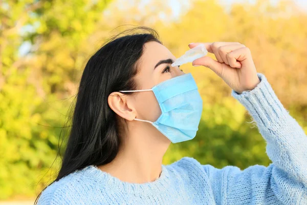 Young Allergic Woman Using Eye Drops Outdoors — Stock Photo, Image