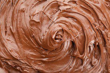 Tatlı erimiş çikolata arka planda, yakın planda.