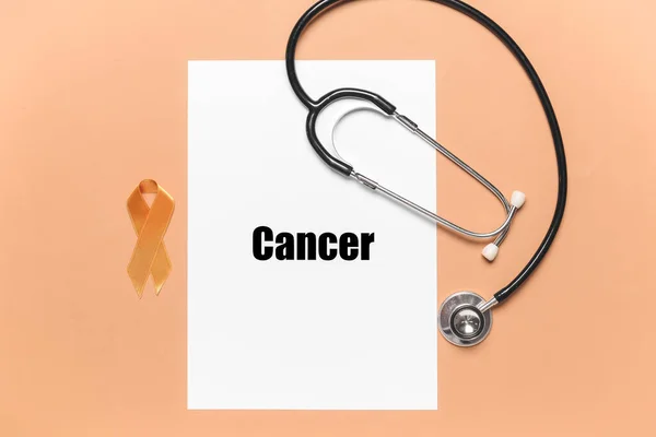 Paper Sheet Word Cancer Stethoscope Golden Ribbon Color Background — Foto Stock
