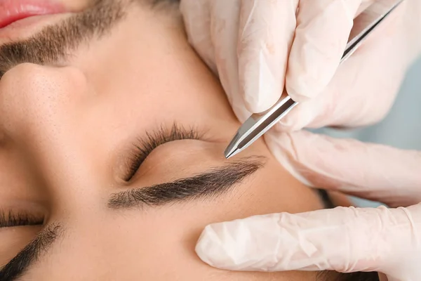 Young Man Undergoing Eyebrow Correction Procedure Beauty Salon Closeup — Stock Photo, Image