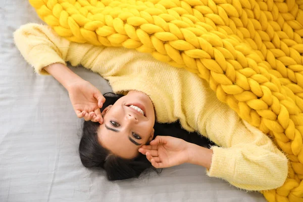 Beautiful Young Woman Covered Warm Plaid Lying Bed Top View — Stock Photo, Image