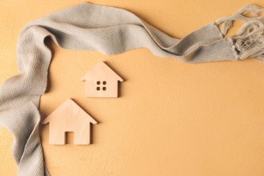 Masada ev ve sıcak eşarp figürleri var. Isınma mevsimi kavramı