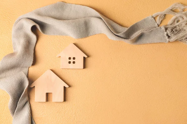 Masada ev ve sıcak eşarp figürleri var. Isınma mevsimi kavramı