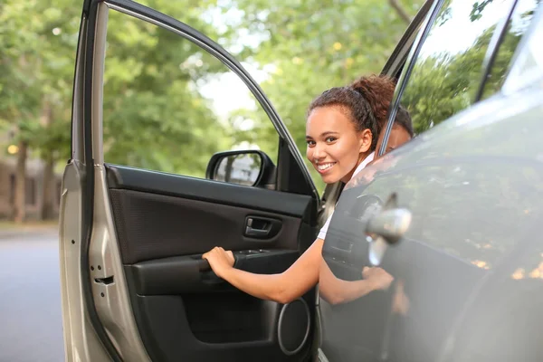 African-American female driver in car