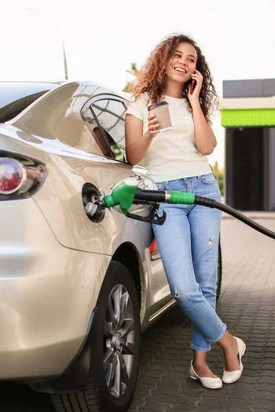 African American Woman Talking Phone While Filling Car Tank Gas — Stock Photo, Image