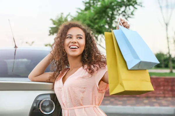 Young African American Woman Shopping Bags Car Outdoors — Stock Photo, Image