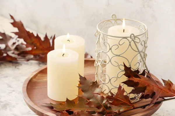 Beautiful Aroma Candles Autumn Leaves Grey Background — Stock Photo, Image