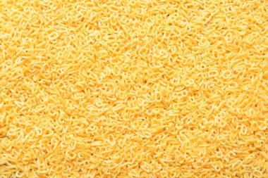 Arkaplan olarak lezzetli pişmemiş makarna