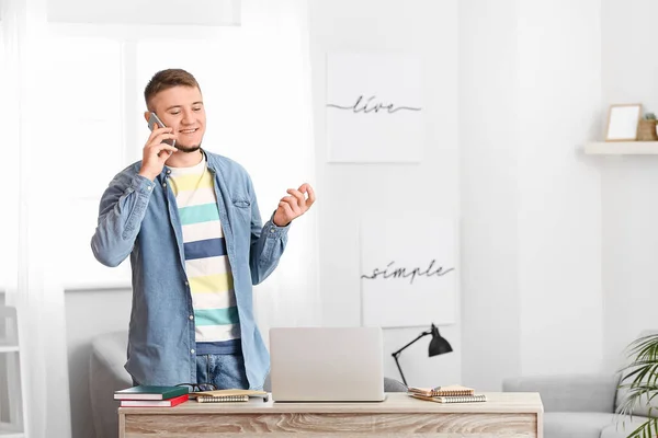Young Man Talking Mobile Phone Home — Stock Photo, Image