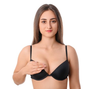 Beyaz arka planda sütyenli genç bir kadın.