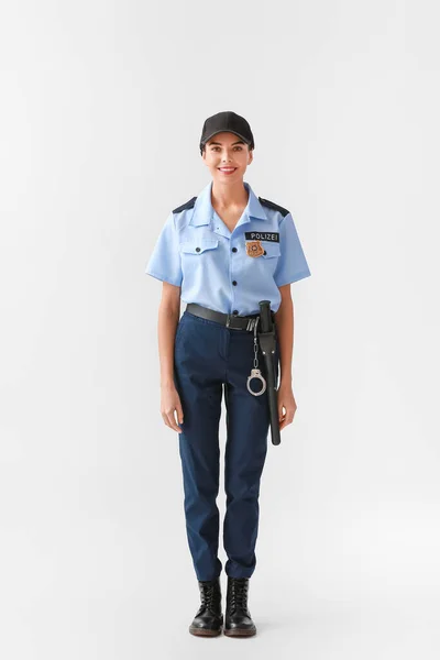 Kvindelig Politibetjent Lys Baggrund - Stock-foto